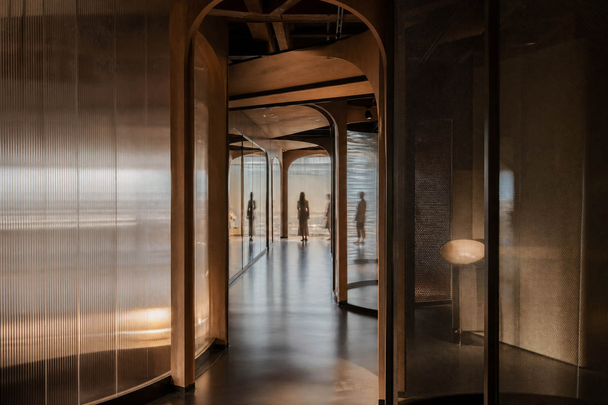 Immersive interior passage using timber, translucent glass, mesh and controlled reflections