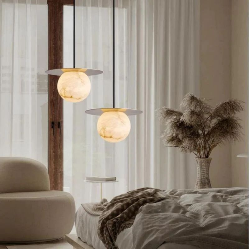 Alabaster Sphere Pendant Light Above Bed